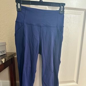 Lululemon leggings. Blue. Size 4. Butt area had some wear and tear.